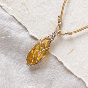 Citrine amber wire wrapped energy stone pendant on linen and handmade paper